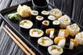 Delicious Japanese sushi rolls big set close-up on a plate. horizontal Royalty Free Stock Photo