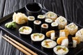 Delicious Japanese sushi rolls large set with seafood, vegetables, tofu and tamago closeup. horizontal Royalty Free Stock Photo