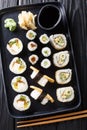 Delicious Japanese sushi rolls large set with seafood, vegetables, tofu and tamago closeup. Vertical top view Royalty Free Stock Photo