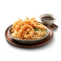 Delicious Japanese Udon Noodles with Crispy Tempura on a White Plate.