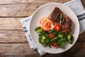 Delicious juicy barbequed steak and prawns with vegetable salad Royalty Free Stock Photo