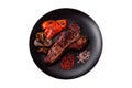 Delicious juicy beef tbone steak with salt, spices and herbs