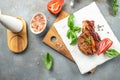 Delicious juicy grilled pork steak on a light background. Restaurant menu, dieting, cookbook recipe top view Royalty Free Stock Photo