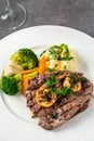 Delicious juicy grilled steak and shrimp with grilled broccoli and cauliflower.  Surf and Turf style Royalty Free Stock Photo