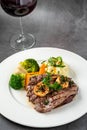 Delicious juicy grilled steak and shrimp with grilled broccoli and cauliflower.  Surf and Turf style Royalty Free Stock Photo