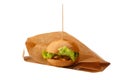 Delicious and juicy hamburger in recyclable craft brownpaper Royalty Free Stock Photo