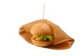 Delicious and juicy hamburger in recyclable craft brownpaper Royalty Free Stock Photo