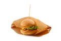 Delicious and juicy hamburger in recyclable craft brownpaper Royalty Free Stock Photo