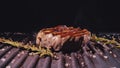 Delicious juicy meat steak cooking on grill. Prime beef fry on electric roaster, rosemary, black pepper, salt. Slow Royalty Free Stock Photo