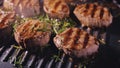 Delicious juicy meat steak cooking on grill. Prime beef fry on electric roaster, rosemary, black pepper, salt. Slow