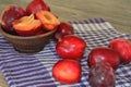 delicious juicy plums on a purple towel Royalty Free Stock Photo