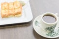 Delicious Kaya toast with jam and kopitiam coffee mug in traditional Chinese breakfast