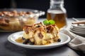 Delicious Kentucky bread pudding with rich buttery Bourbon vanilla sauce on a plate. Traditional American cuisine dessert