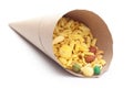 Delicious Khatta Meetha In handmade handcraft brown paper cone bag, made with peanuts, sugar, raisins, and besan sev. Pile of