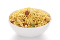 Delicious Khatta Meetha in a white ceramic bowl made with peanuts sugar raisins and besan sev