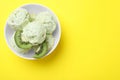 Delicious kiwi ice cream on yellow background, top view. Space for text Royalty Free Stock Photo