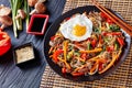 Delicious korean dish Japchae: on a black plate Royalty Free Stock Photo