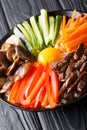 Delicious Korean food Bibimbap with beef, yolk, vegetables, mush Royalty Free Stock Photo