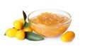 Delicious kumquat jam in bowl and fresh fruits on white background Royalty Free Stock Photo