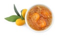 Delicious kumquat jam in bowl and fresh fruits on white background, top view Royalty Free Stock Photo