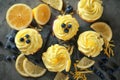 Delicious lemon cupcakes on table, top view