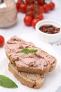 Delicious liverwurst sandwich with basil on white table