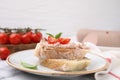 Delicious liverwurst sandwich with tomatoes and basil on white marble table, closeup Royalty Free Stock Photo