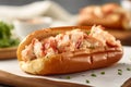 Delicious lobster roll tossed with mayo in a toasted brioche bun. Traditional New England cuisine specialty