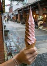 The delicious long Ice-cream cone (mixed strawberry and chocolate flavor) at food street market Royalty Free Stock Photo