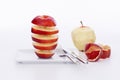 Delicious looking red apple on a plate with cutlery