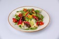 Delicious looking tossed chefs salad or antipasto with meat, Camembert cheese and tomato