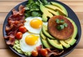 Delicious Low-Carb Plates with Avocado, Eggs, and Bacon Royalty Free Stock Photo