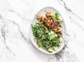 Delicious lunch - chicken bacon skewers and couscous, avocado, arugula salad on a light background top view