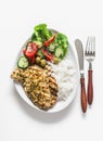 Delicious lunch - lime, cilantro, garlic olive oil marinated grilled chicken breast, basmati rice and fresh vegetable salad on a Royalty Free Stock Photo