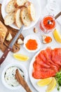 Delicious lunch with salted salmon, red caviar, fresh bread and