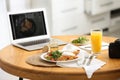 Delicious lunch served on table with laptop