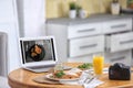 Delicious lunch served on table with laptop