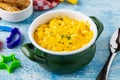 Delicious Mac n Cheese or macaroni and cheese on a green porcelain plate Royalty Free Stock Photo