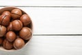 Delicious Macadamia nuts on white wooden table, top view. Space for text Royalty Free Stock Photo