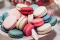 delicious macaroons close-up. candy bar at luxury wedding reception. exclusive expensive catering. table with modern desserts. sp