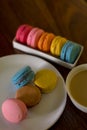 Delicious macaroons on the wooden table, with copy space