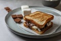 Delicious marshmallow sandwiches with bread and chocolate on wooden table, closeup