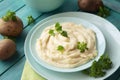 Delicious mashed potatoes with parsley in a turquoise bowl with vegetables Royalty Free Stock Photo