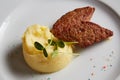 Delicious mashed potatoes sprinkled with greens, juicy meat cutlets Royalty Free Stock Photo