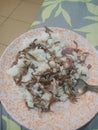 A delicious meal comprising of rice and Omena popularly known as small fish in Kenya