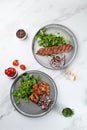 Delicious meat kebab with fresh vegetable. Grilled meat kebabs, vegetables on a marble table Royalty Free Stock Photo