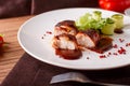 Delicious meat loaf with ketchup on a white plate, macro horizontal Royalty Free Stock Photo