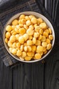 Delicious Mediterranean lupine beans close-up in a bowl. Vertical top view