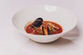 Delicious Mediterranean style tomato seafood soup with a variety of mixed seafood.