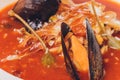 Delicious Mediterranean style tomato seafood soup with a variety of mixed seafood.